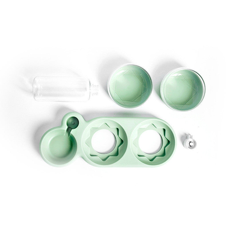 Mint green pet feeding and water bowl set on a white background