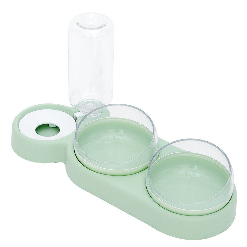 Green pet feeder with three transparent bowls on a white background