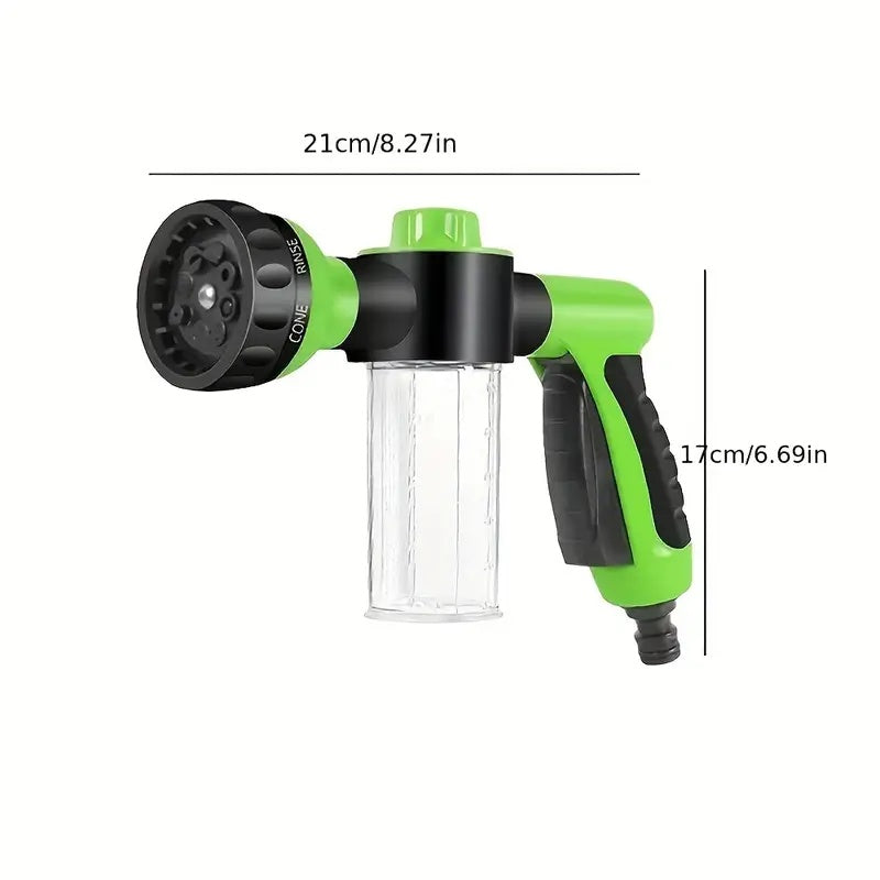 Green and black garden hose spray nozzle with measurements on a white background