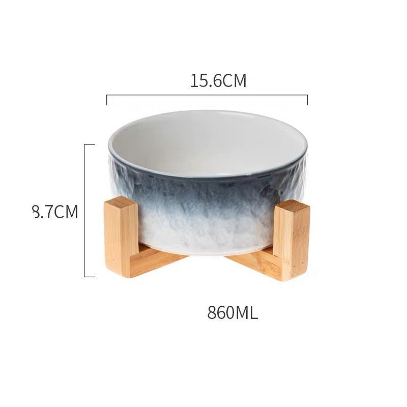 Ceramic bowl with wooden stand and measurements on a white background