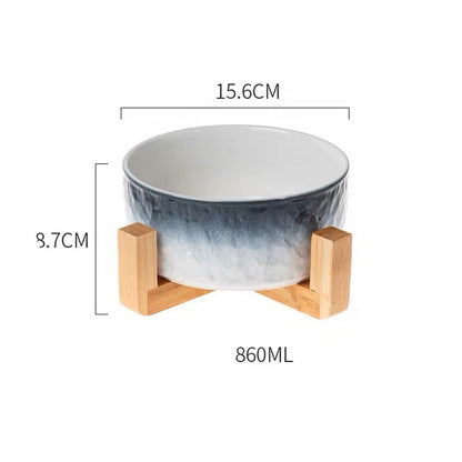 Ceramic bowl with wooden stand and measurements on a white background