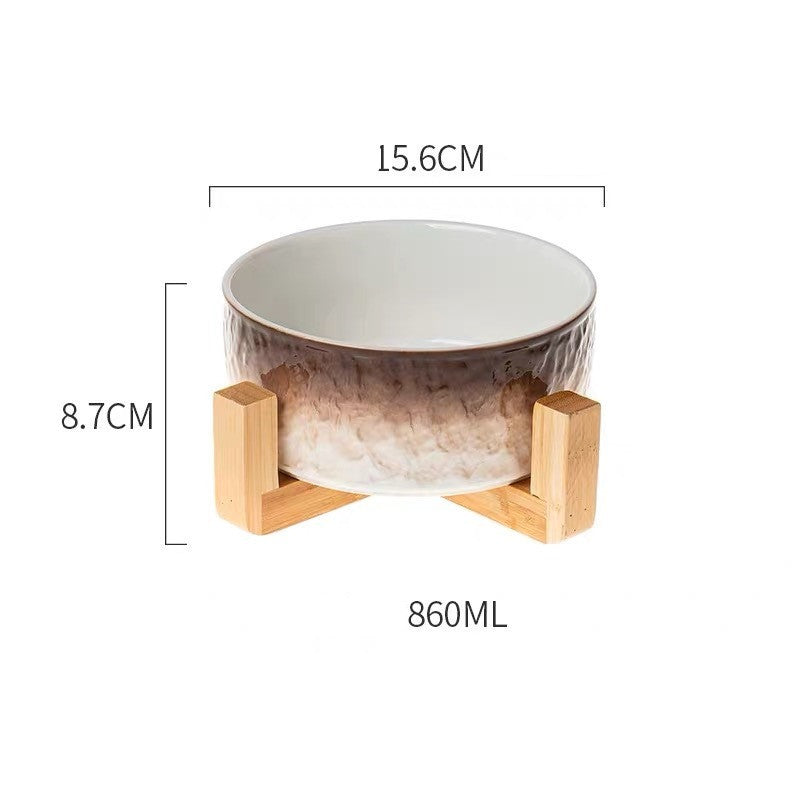 Ceramic bowl with wooden stand and measurements on a white background
